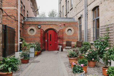Entrance to Depaul's Back Lane hostel with blossoming garden in front